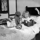 December 1929: A toddler sitting in bed with a collection of christmas gifts. (Photo by Fox Photos/Getty Images).
